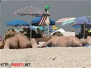 light-haired model nudist on the bare beach spycam video