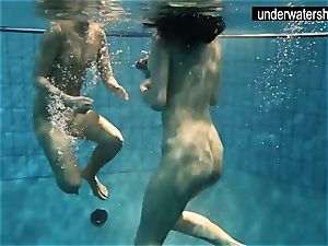 two super-sexy amateurs showing their bods off under water